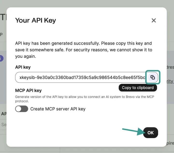 Brevo Your API Key dialog with the generated key shown and the copy to clipboard button highlighted